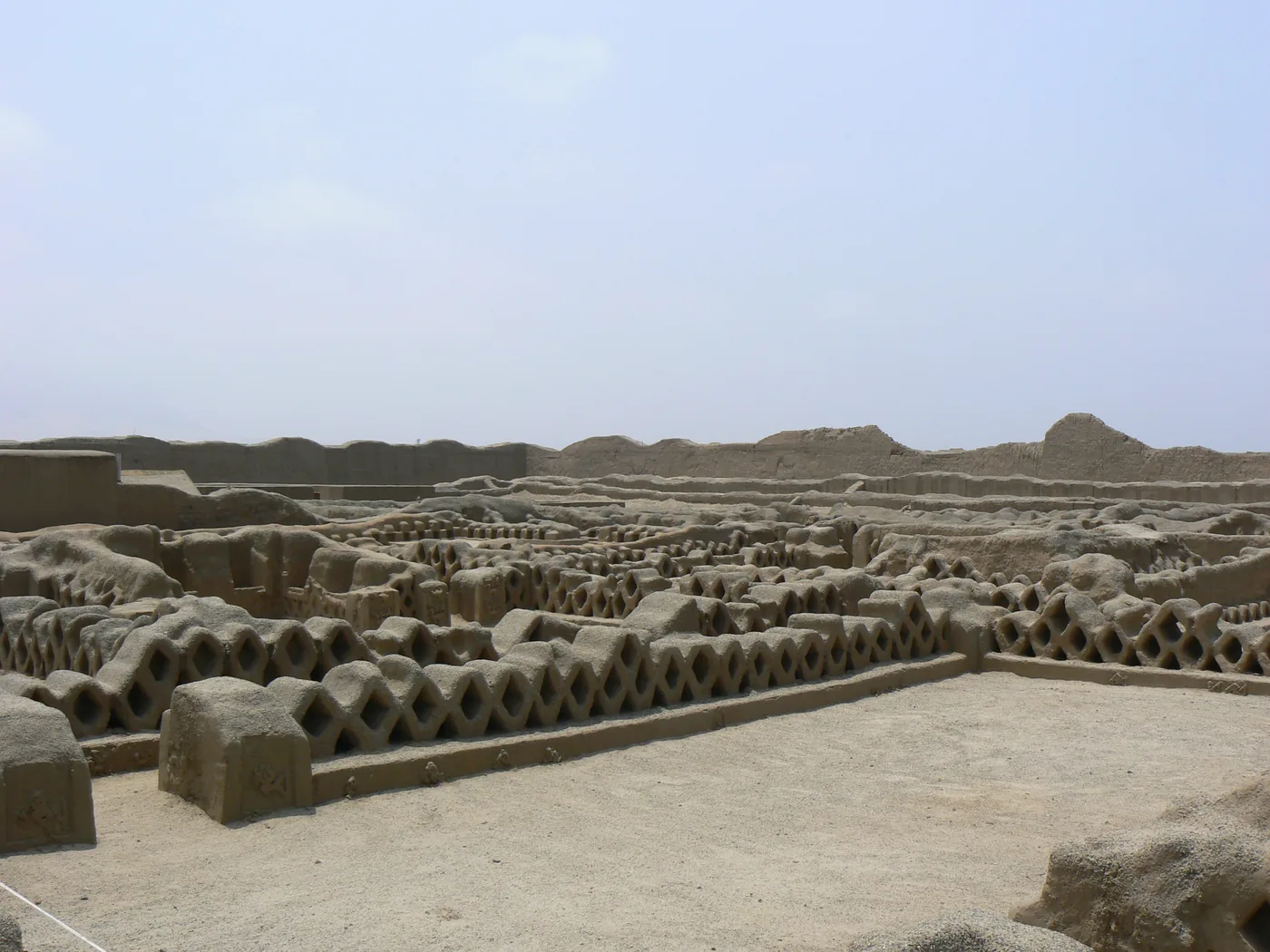 The high earthen walls and corridors of the Nik An palace at Chan Chan